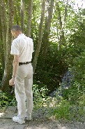 Examining brook near Ehrenberg in Italian Alps