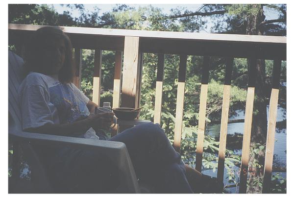 Kitty enjoys breakfast on the cottage deck