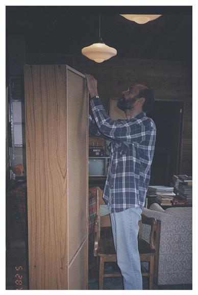 Tom reassembling bookcase