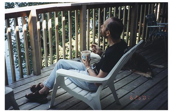 Tom enjoys breakfast on the cottage deck