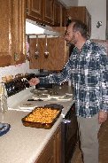 Paul readies the oven for one of our last main meals of the year 2003