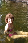 Kitty manages a smile while sitting in ice water