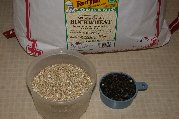 Whole unhulled buckwheat (berries) on the right and hulled untoasted (groats) on the left