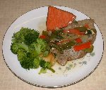 Braised pork chop, peppers & onions with sweet potato and broccoli