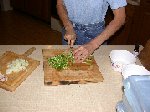 Finely chopping collard stems after chopping onion