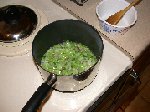 Small amount of water added to sauteed chopped stems, onions and bacon