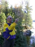 Paul lets the wind disperse the milkweed pod silk