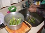 Paul cleans milkweed shoots picked just up the road