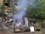 Paul readies the cooking fire on Aug 5, 3rd full day w/o electricity