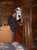 Paul begins a temporary placing of logs for wall to new doorway