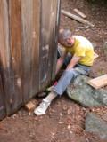 Paul adjusts coated beam; safety block still near his foot