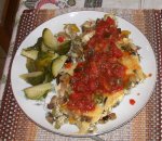 Paul's serving of fritata topped with tomato-zuchinni accompanied by brussel sprouts