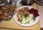 Baked cod fillets, vegetables and puffballs along with beets and steamed veggies